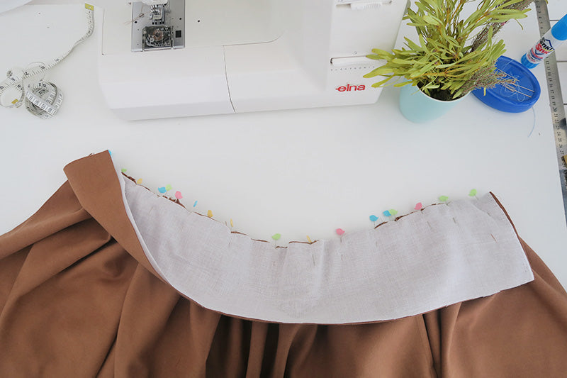 Pin waistband in place