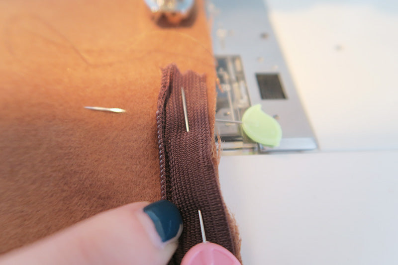 Push zip teeth out the way