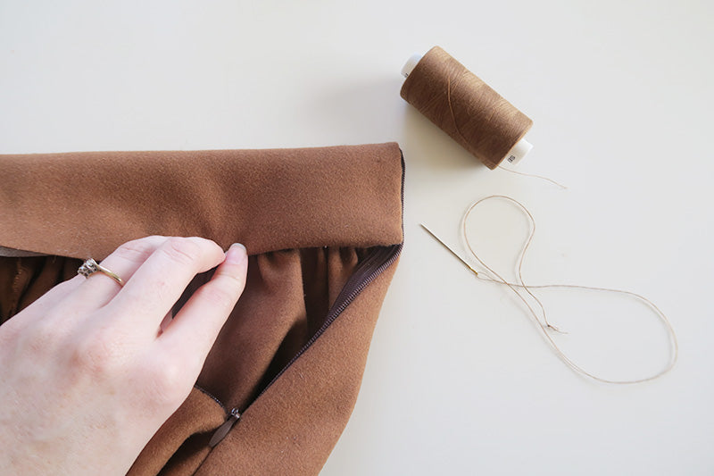 Fold raw edge to the inside