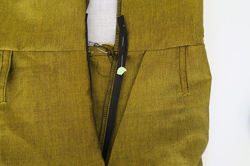 Stitch the zip in place