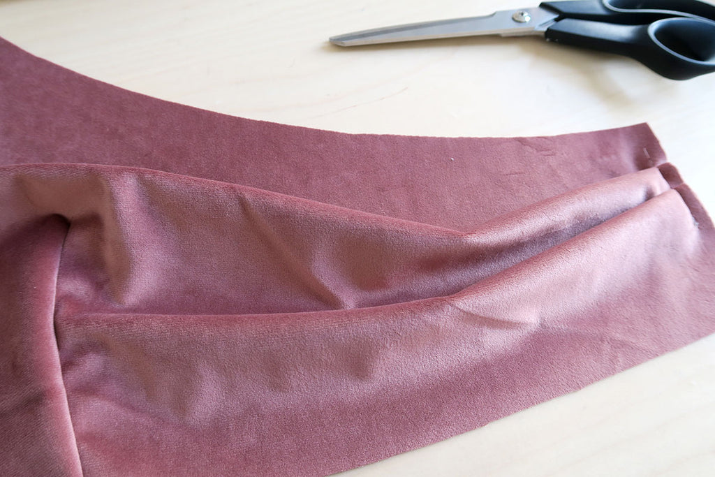 Baste pleats in place