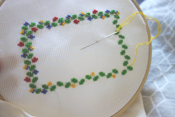 Frame of flowers in embroidery hoop