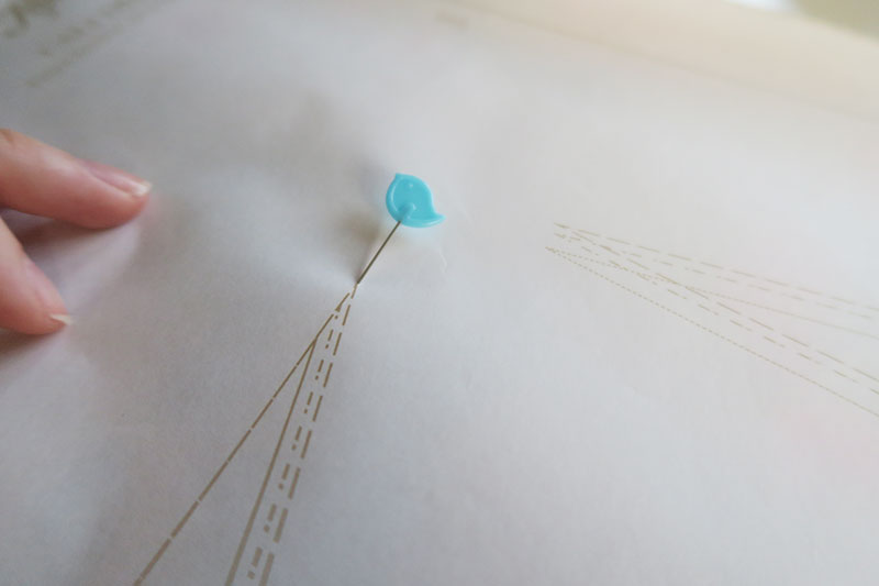 Indicate the top of the dart with a pin